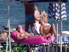 Topless women sunbathing