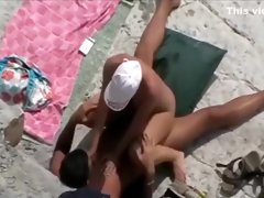 Cock riding on a beach