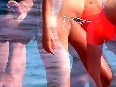 Beach voyeur films a pretty brunette teen in a sexy bikini