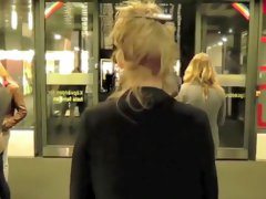 Brave blonde urinates on the middle of the crowded street!