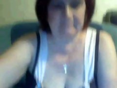 I chat with aroused granny and she fondles her pussy in front of me