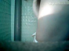 Pale skin lovely female thoroughly wipes her pussy in the toilet
