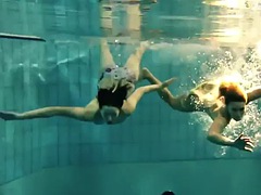 Two sexy amateurs showing off their bodies underwater